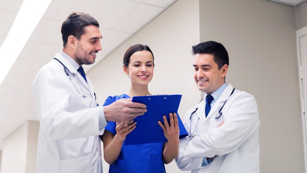 Clinical team reviewing a patient's chart