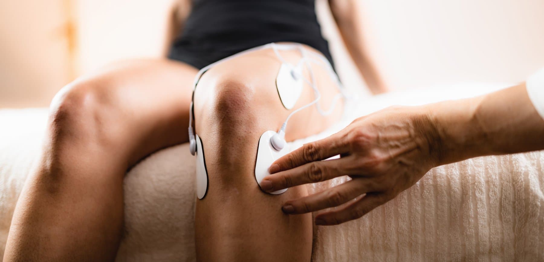 TENS electrode pads used during knee physical therapy